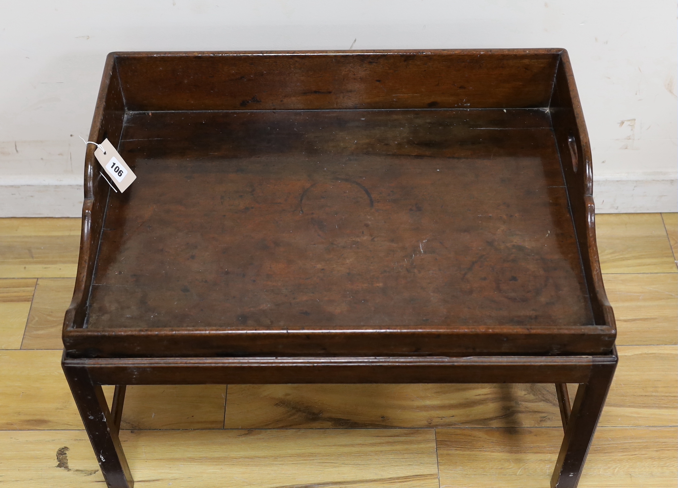A Victorian rectangular mahogany butler's tray on associated stand, width 69cm, depth 50cm, height 47cm